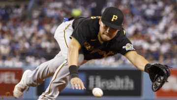 LOS ANGELES, CALIFORNIA - AUGUST 17: Yoshi Tsutsugo #32 of the Pittsburgh Pirates dives for the ball and makes a fielding error against the Los Angeles Dodgers during the fourth inning at Dodger Stadium on August 17, 2021 in Los Angeles, California. (Photo by Michael Owens/Getty Images)