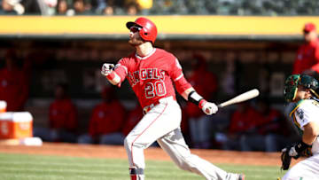 OAKLAND, CALIFORNIA - MAY 29: Jonathan Lucroy #20 of the Los Angeles Angels hits a single that scored two runs in the 11th inning against the Oakland Athletics at Oakland-Alameda County Coliseum on May 29, 2019 in Oakland, California. (Photo by Ezra Shaw/Getty Images)