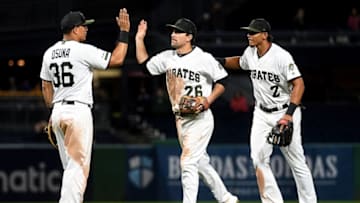 PITTSBURGH, PA - SEPTEMBER 26: Jose Osuna #36 of the Pittsburgh Pirates celebrates with Adam Frazier #26 and Erik Gonzalez #2 after the final out in a 9-5 win over the Chicago Cubs at PNC Park on September 26, 2019 in Pittsburgh, Pennsylvania. (Photo by Justin Berl/Getty Images)