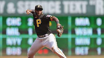 CINCINNATI, OH - SEPTEMBER 28: Josh Harrison #5 of the Pittsburgh Pirates throws out Kris Negron #17 of the Cincinnati Reds in the sixth inning at Great American Ball Park on September 28, 2014 in Cincinnati, Ohio. Cincinnati defeated Pittsburgh 4-1. (Photo by Jamie Sabau/Getty Images)
