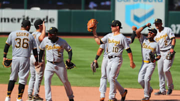 ST LOUIS, MO - JULY 26: Guillermo Heredia #5, Bryan Reynolds #10 and Jarrod Dyson #6 of the Pittsburgh Pirates celebrate with teammates after beating the St. Louis Cardinals at Busch Stadium on July 26, 2020 in St Louis, Missouri. (Photo by Dilip Vishwanat/Getty Images)