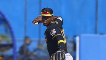 Mar 1, 2019; Dunedin, FL, USA; Pittsburgh Pirates third baseman Rodolfo Castro (90) throws to first base to retire Toronto Blue Jays catcher Luke Maile (not pictured) during the sixth inning at Dunedin Stadium. Mandatory Credit: Butch Dill-USA TODAY Sports