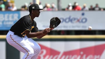 Mar 9, 2020; Bradenton, Florida, USA; Pittsburgh Pirates infielder Ke’Bryan Hayes (13) fields a ground ball in the second inning against the Toronto Blue Jays at LECOM Park. Mandatory Credit: Jonathan Dyer-USA TODAY Sports