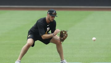 Jul 7, 2020; Pittsburgh, Pennsylvania, United States; Pittsburgh Pirates second baseman JT Riddle (15) fields a ground ball during Summer Training workouts at PNC Park. Mandatory Credit: Charles LeClaire-USA TODAY Sports