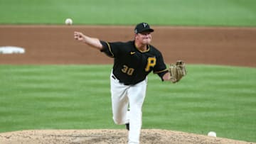 Jul 18, 2020; Pittsburgh, Pennsylvania, USA; Pittsburgh Pirates relief pitcher Kyle Crick (30) pitches against the Cleveland Indians during the eighth inning at PNC Park. Mandatory Credit: Charles LeClaire-USA TODAY Sports