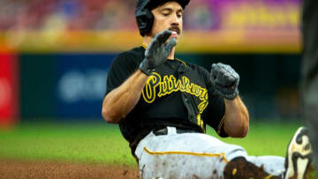 Pittsburgh Pirates left fielder Bryan Reynolds (10) slides into third after hitting an RBI triple in the third inning of the MLB baseball game between the Cincinnati Reds and the Pittsburgh Pirates on Saturday, Aug. 7, 2021, at Great American Ball Park in Cincinnati.Cincinnati Reds Pittsburgh Pirates