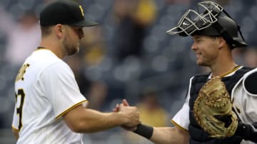 Apr 13, 2022; Pittsburgh, Pennsylvania, USA; Pittsburgh Pirates starting pitcher Wil Crowe (29) and catcher Andrew Knapp (31) celebrate after defeating the Chicago Cubs at PNC Park. Pittsburgh won 6-2. Mandatory Credit: Charles LeClaire-USA TODAY Sports