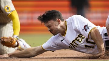 May 1, 2022; Pittsburgh, Pennsylvania, USA; Pittsburgh Pirates center fielder Bryan Reynolds (10) reaches for thirds base as he gets tagged out during the sixth inning at PNC Park. Mandatory Credit: Scott Galvin-USA TODAY Sports