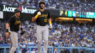 May 31, 2022; Los Angeles, California, USA; Pittsburgh Pirates left fielder Tucupita Marcano (30) celebrates with catcher Tyler Heineman (54) after hitting a two-run home run in the second inning against the Los Angeles Dodgers at Dodger Stadium. Mandatory Credit: Kirby Lee-USA TODAY Sports