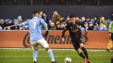 Nov 21, 2021; Bronx, NY, USA; Atlanta United midfielder Matheus Rossetto (9) dribbles the ball against New York City FC midfielder Alfredo Morales (7) during the second half in a round one MLS Playoff game at Yankee Stadium. Mandatory Credit: Jonathan Jones-USA TODAY Sports