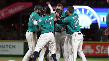 SEATTLE, WASHINGTON - APRIL 26: The Seattle Mariners celebrate after defeating the Texas Rangers 5-4 from a groundout by Mitch Haniger #17 of the Seattle Mariners to score Omar Narvaez #22 of the Seattle Mariners in the eleventh inning during their game at T-Mobile Park on April 26, 2019 in Seattle, Washington. (Photo by Abbie Parr/Getty Images)