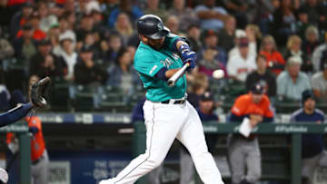 SEATTLE, WASHINGTON - JUNE 06: Edwin Encarnacion #10 of the Seattle Mariners hits an RBI single to score Dylan Moore #25 of the Seattle Mariners to tie the game 6-6 in the ninth inning against the Houston Astros during their game at T-Mobile Park on June 06, 2019 in Seattle, Washington. (Photo by Abbie Parr/Getty Images)