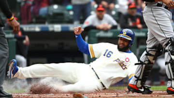 SEATTLE, WASHINGTON - JUNE 22: Domingo Santana #16 scores off an RBI double by Daniel Vogelbach #20 of the Seattle Mariners in the first inning during their game at T-Mobile Park on June 22, 2019 in Seattle, Washington. (Photo by Abbie Parr/Getty Images)