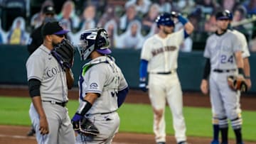 SEATTLE, WA - AUGUST 09: Starting pitcher German Marquez #48 of the Colorado Rockies and catcher Elias Diaz #35 meet at the mound after walking Joe Hudson #57 of the Seattle Mariners during the sixth inning of a game at T-Mobile Park on August, 9, 2020 in Seattle, Washington. The Mariners won 5-3. (Photo by Stephen Brashear/Getty Images)