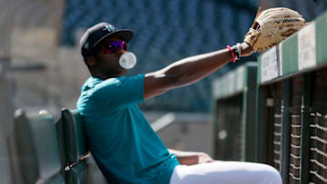 SEATTLE, WASHINGTON - APRIL 30: Taylor Trammell #20 of the Seattle Mariners looks on from the dugout. He is currently with the Tacoma Rainiers. (Photo by Steph Chambers/Getty Images)