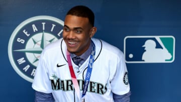 SEATTLE, WASHINGTON - OCTOBER 02: Julio Rodríguez, a prospect with the Seattle Mariners and bronze medalist with Dominincan Republic, looks on before the game against the Los Angeles Angels at T-Mobile Park on October 02, 2021 in Seattle, Washington. (Photo by Steph Chambers/Getty Images)
