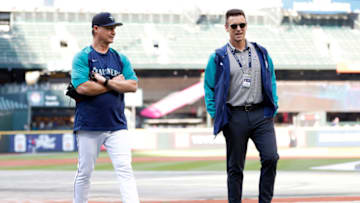 SEATTLE, WASHINGTON - SEPTEMBER 29: (L-R) Manager Scott Servais #9 and General Manager Jerry DiPoto of the Seattle Mariners look on during batting practice before the game against the Texas Rangers at T-Mobile Park on September 29, 2022 in Seattle, Washington. (Photo by Steph Chambers/Getty Images)