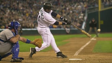 SEATTLE - APRIL 13: Designated hitter Edgar Martinez #11 of the Seattle Mariners makes contact with the ball during the game against the Texas Rangers at Safeco Field on April 13, 2003 in Seattle Washington. The Mariners defeated the Rangers 4-3 in extra innings. (Photo by Otto Greule/Getty Images)