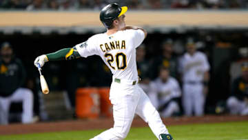 OAKLAND, CALIFORNIA - SEPTEMBER 20: Mark Canha #20 of the Oakland Athletics bats against the Seattle Mariners in the bottom of the fourth inning at RingCentral Coliseum on September 20, 2021 in Oakland, California. (Photo by Thearon W. Henderson/Getty Images)