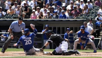 Jun 25, 2016; Chicago, IL, USA; Chicago White Sox catcher Dioner Navarro (27) tags out Toronto Blue Jays designated hitter Josh Donaldson (20) at home plate during the second inning at U.S. Cellular Field. Mandatory Credit: David Banks-USA TODAY Sports
