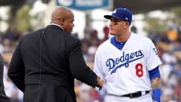 LOS ANGELES, CA - OCTOBER 28: Former MLB player Frank Thomas and Manny Machado #8 of the Los Angeles Dodgers shake hands prior to Game Five of the 2018 World Series at Dodger Stadium on October 28, 2018 in Los Angeles, California. (Photo by Harry How/Getty Images)