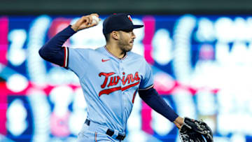 MINNEAPOLIS, MN - SEPTEMBER 27: Carlos Correa #4 of the Minnesota Twins throws the ball to first base to get out Elvis Andrus #1 of the Chicago White Sox in the sixth inning of the game at Target Field on September 27, 2022 in Minneapolis, Minnesota. The Twins defeated the White Sox 4-0. (Photo by David Berding/Getty Images)