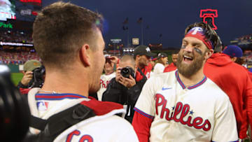PHILADELPHIA, PENNSYLVANIA - OCTOBER 23: (EDITOR'S NOTE: Alternate crop) Bryce Harper #3 of the Philadelphia Phillies celebrates with J.T. Realmuto #10 after defeating the San Diego Padres in game five to win the National League Championship Series at Citizens Bank Park on October 23, 2022 in Philadelphia, Pennsylvania. (Photo by Mike Ehrmann/Getty Images)