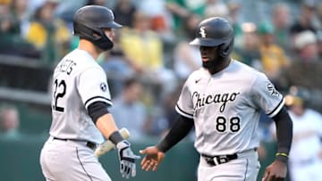OAKLAND, CALIFORNIA - SEPTEMBER 07: Luis Robert #88 of the Chicago White Sox is congratulated by Gavin Sheets #32 after Robert scored against the Oakland Athletics in the top of the first inning at RingCentral Coliseum on September 07, 2021 in Oakland, California. (Photo by Thearon W. Henderson/Getty Images)