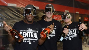 CLEVELAND - SEPTEMBER 23: Tim Anderson, Gavin Sheets and Andre Vaughn (L to R) of the Chicago White Sox celebrate clinching the American League Central title following the second game of a doubleheader against the Cleveland Indians on September 23, 2021 at Progressive Field in Cleveland, Ohio. The White Sox clinched the American League Central title by wining the first game of the doubleheader. (Photo by Ron Vesely/Getty Images)