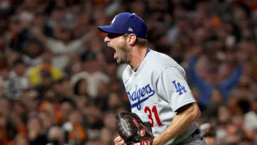 SAN FRANCISCO, CALIFORNIA - OCTOBER 14: Max Scherzer #31 of the Los Angeles Dodgers celebrates after beating the San Francisco Giants 2-1 in game 5 of the National League Division Series at Oracle Park on October 14, 2021 in San Francisco, California. (Photo by Harry How/Getty Images)