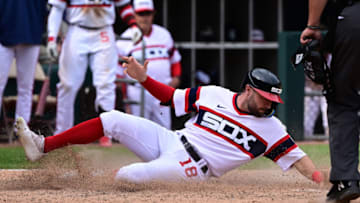 CHICAGO, ILLINOIS - MAY 29: AJ Pollock #18 of the Chicago White Sox beats to the Chicago Cubs to score in the 11th inning at Guaranteed Rate Field on May 29, 2022 in Chicago, Illinois. (Photo by Quinn Harris/Getty Images)