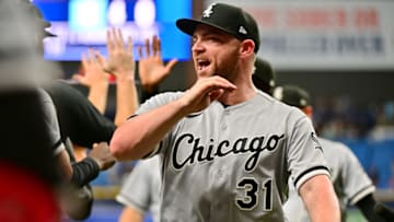 ST PETERSBURG, FLORIDA - JUNE 04: Liam Hendriks #31 of the Chicago White Sox celebrates with teammates after defeating the Tampa Bay Rays 3-2 at Tropicana Field on June 04, 2022 in St Petersburg, Florida. (Photo by Julio Aguilar/Getty Images)
