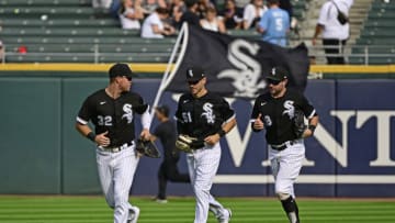 CHICAGO, ILLINOIS - SEPTEMBER 01: Gavin Sheets #32, Adam Haseley #51 and AJ Pollock #18 of the Chicago White Sox celebrate a 7-1 win against the Kansas City Royals at Guaranteed Rate Field on September 01, 2022 in Chicago, Illinois. (Photo by Quinn Harris/Getty Images)