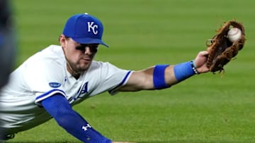 KANSAS CITY, MISSOURI - SEPTEMBER 07: Michael Massey #19 of the Kansas City Royals dives for a ball hit by Andres Gimenez of the Cleveland Guardians in the sixth inning at Kauffman Stadium on September 07, 2022 in Kansas City, Missouri. (Photo by Ed Zurga/Getty Images)