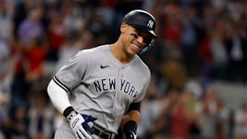 ARLINGTON, TX - OCTOBER 4:Aaron Judge #99 of the New York Yankees rounds the bases after hitting his 62nd home run of the season against the Texas Rangers during the first inning in game two of a double header at Globe Life Field on October 4, 2022 in Arlington, Texas. Judge has now set the American League record for home runs in a single season. (Photo by Ron Jenkins/Getty Images)