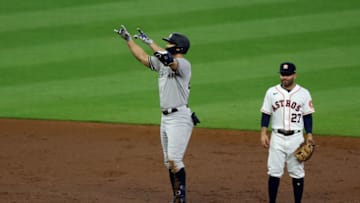 HOUSTON, TEXAS - OCTOBER 19: Giancarlo Stanton #27 of the New York Yankees celebrates a double during the third inning against the Houston Astros in game one of the American League Championship Series at Minute Maid Park on October 19, 2022 in Houston, Texas. (Photo by Rob Carr/Getty Images)