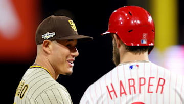 PHILADELPHIA, PENNSYLVANIA - OCTOBER 22: Manny Machado #13 and Bryce Harper #3 of the Philadelphia Phillies talk on third base during the first inning in game four of the National League Championship Series at Citizens Bank Park on October 22, 2022 in Philadelphia, Pennsylvania. (Photo by Michael Reaves/Getty Images)