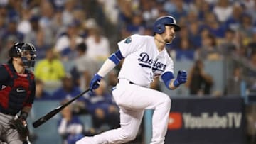 LOS ANGELES, CA - OCTOBER 26: Yasmani Grandal #9 of the Los Angeles Dodgers singles during the fifth inning against the Boston Red Sox in Game Three of the 2018 World Series at Dodger Stadium on October 26, 2018 in Los Angeles, California. (Photo by Ezra Shaw/Getty Images)