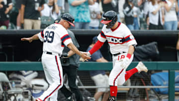 Aug 14, 2022; Chicago, Illinois, USA; Chicago White Sox left fielder AJ Pollock (18) celebrates with third base coach Joe McEwing (99) as he rounds the bases after hitting a solo home run against the Detroit Tigers during the third inning at Guaranteed Rate Field. Mandatory Credit: Kamil Krzaczynski-USA TODAY Sports