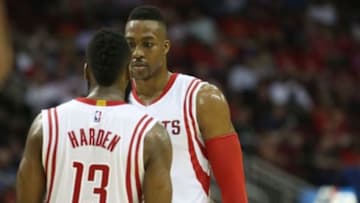 Jan 19, 2015; Houston, TX, USA; Houston Rockets guard James Harden (13) talks with center Dwight Howard (12) during a Indiana Pacers timeout in the second half at Toyota Center. Rockets won 110 to 98. Mandatory Credit: Thomas B. Shea-USA TODAY Sports