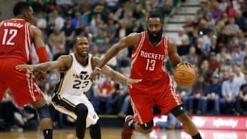 Jan 4, 2016; Salt Lake City, UT, USA; Houston Rockets guard James Harden (13) dribbles past Utah Jazz forward Chris Johnson (23) in the second quarter at Vivint Smart Home Arena. Mandatory Credit: Jeff Swinger-USA TODAY Sports