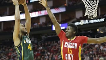 Jan 7, 2016; Houston, TX, USA; Utah Jazz forward Trey Lyles (41) dunks against Houston Rockets forward Clint Capela (15) in the second quarter at Toyota Center. Mandatory Credit: Thomas B. Shea-USA TODAY Sports