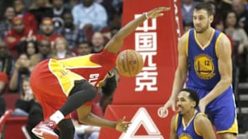 Dec 31, 2015; Houston, TX, USA; Houston Rockets guard James Harden (13) is called for charging against the Golden State Warriors guard Shaun Livingston (34) in the second half at Toyota Center. The Warriors won 114 to 110. Mandatory Credit: Thomas B. Shea-USA TODAY Sports