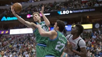 Dec 4, 2015; Dallas, TX, USA; Dallas Mavericks forward Dirk Nowitzki (41) grabs a rebound in front of center Zaza Pachulia (27) and Houston Rockets center Clint Capela (15) during the second half at the American Airlines Center. The Rockets defeat the Mavericks 100-96. Mandatory Credit: Jerome Miron-USA TODAY Sports