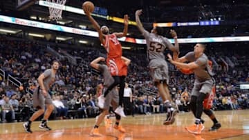 Feb 4, 2016; Phoenix, AZ, USA; Houston Rockets guard Corey Brewer (33) drives the ball against the Phoenix Suns defense at Talking Stick Resort Arena. Mandatory Credit: Jennifer Stewart-USA TODAY Sports