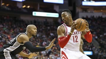 Feb 27, 2016; Houston, TX, USA; Houston Rockets center Dwight Howard (12) controls the ball as San Antonio Spurs center Boris Diaw (33) defends during the third quarter at Toyota Center. The Spurs defeated the Rockets 104-94. Mandatory Credit: Troy Taormina-USA TODAY Sports
