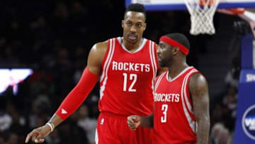 Nov 30, 2015; Auburn Hills, MI, USA; Houston Rockets center Dwight Howard (12) and guard Ty Lawson (3) talk during the fourth quarter against the Detroit Pistons at The Palace of Auburn Hills. Pistons win 116-105. Mandatory Credit: Raj Mehta-USA TODAY Sports