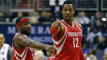 Dec 9, 2015; Washington, DC, USA; Houston Rockets center Dwight Howard (12) talks with Rockets guard Ty Lawson (3) against the Washington Wizards in the fourth quarter at Verizon Center. The Rockets won 109-103. Mandatory Credit: Geoff Burke-USA TODAY Sports