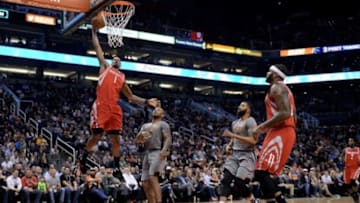 Feb 4, 2016; Phoenix, AZ, USA; Houston Rockets forward Trevor Ariza (1) dunks the ball against Phoenix Suns forward P.J. Tucker (17) at Talking Stick Resort Arena. Mandatory Credit: Jennifer Stewart-USA TODAY Sports