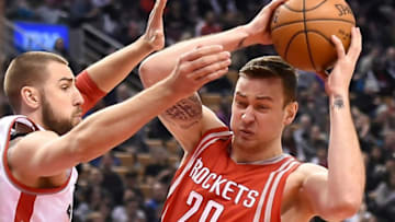 Mar 6, 2016; Toronto, Ontario, CAN; Hoouston Rockets forward Donatas Motiejunas (20) grabs a rebound next to Toronto Raptors center Jonas Valiencunas (17) in the first quarter at Air Canada Centre. Mandatory Credit: Dan Hamilton-USA TODAY Sports